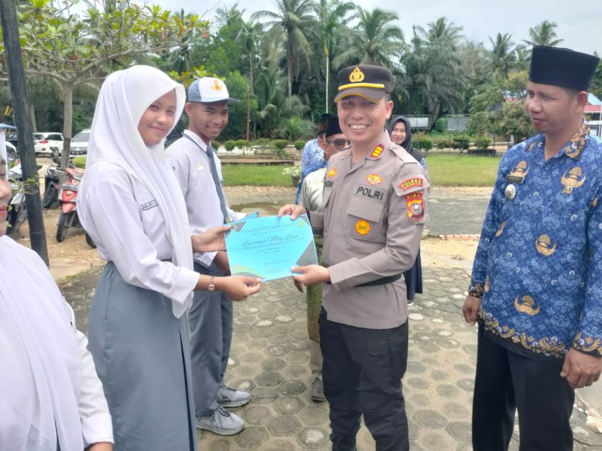 Kapolsek Kempas Bersama Forkopimcam Hadiri Upacara Hardiknas dan Tanam 100 Bibit Pohon